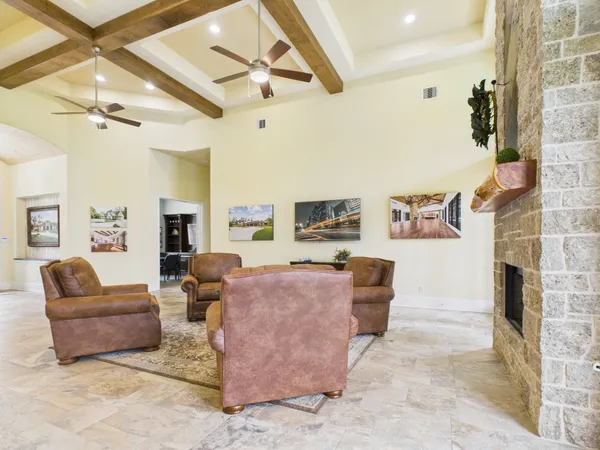 a living room with fireplace furniture and a fireplace