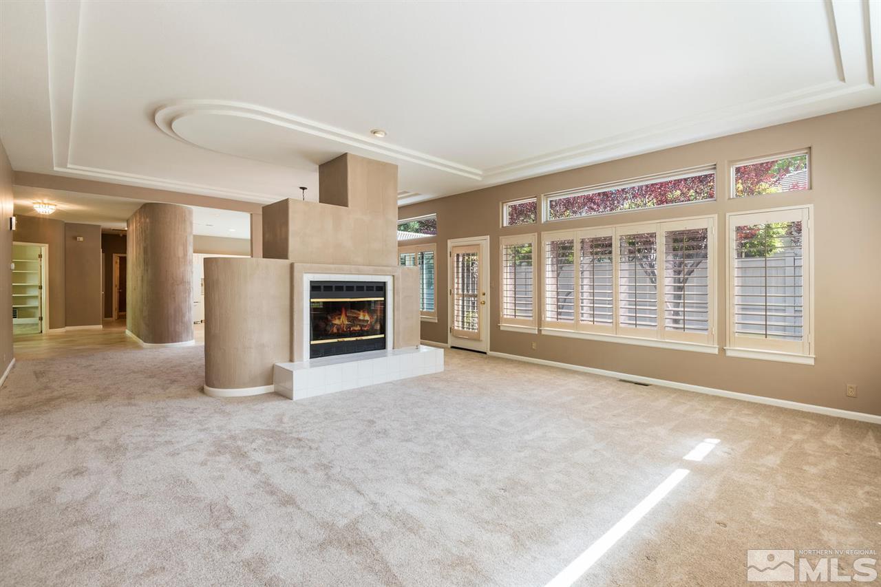 3905 Innsbruck Court Reno, NV 89519 - Photo 5 of 20 a view of an empty room with a fireplace and a window