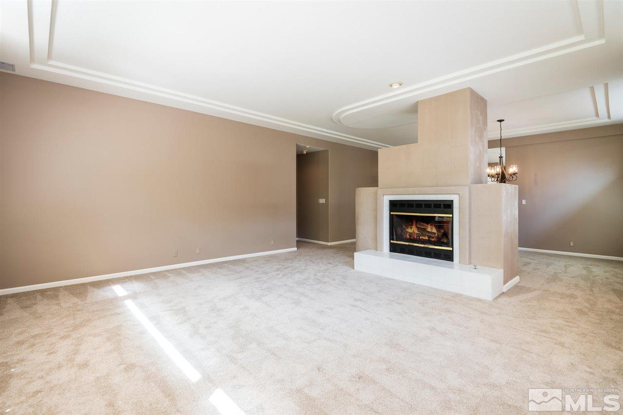 3905 Innsbruck Court Reno, NV 89519 - Photo 6 of 20 a view of empty room with a fireplace