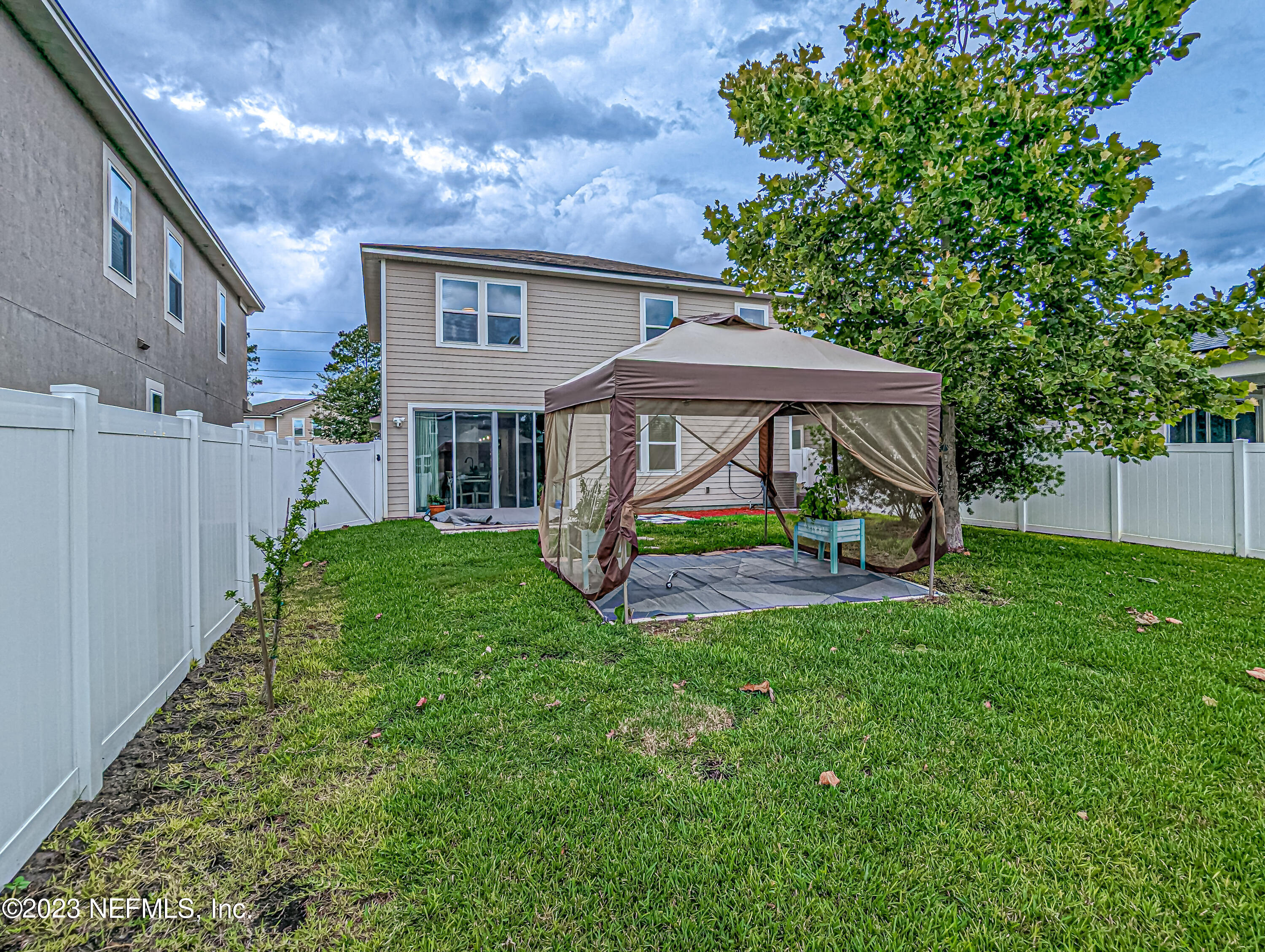 6655 Azalea Park Road Jacksonville, FL 32259 - Photo 29 of 41 a view of a house with backyard and a patio