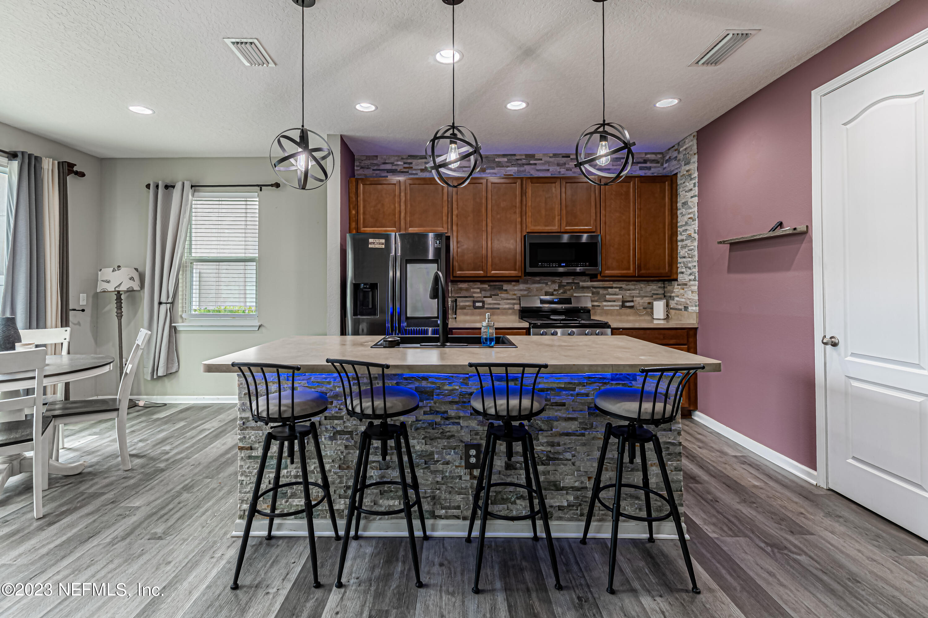 6655 Azalea Park Road Jacksonville, FL 32259 - Photo 8 of 41 a kitchen with a table and chairs in it