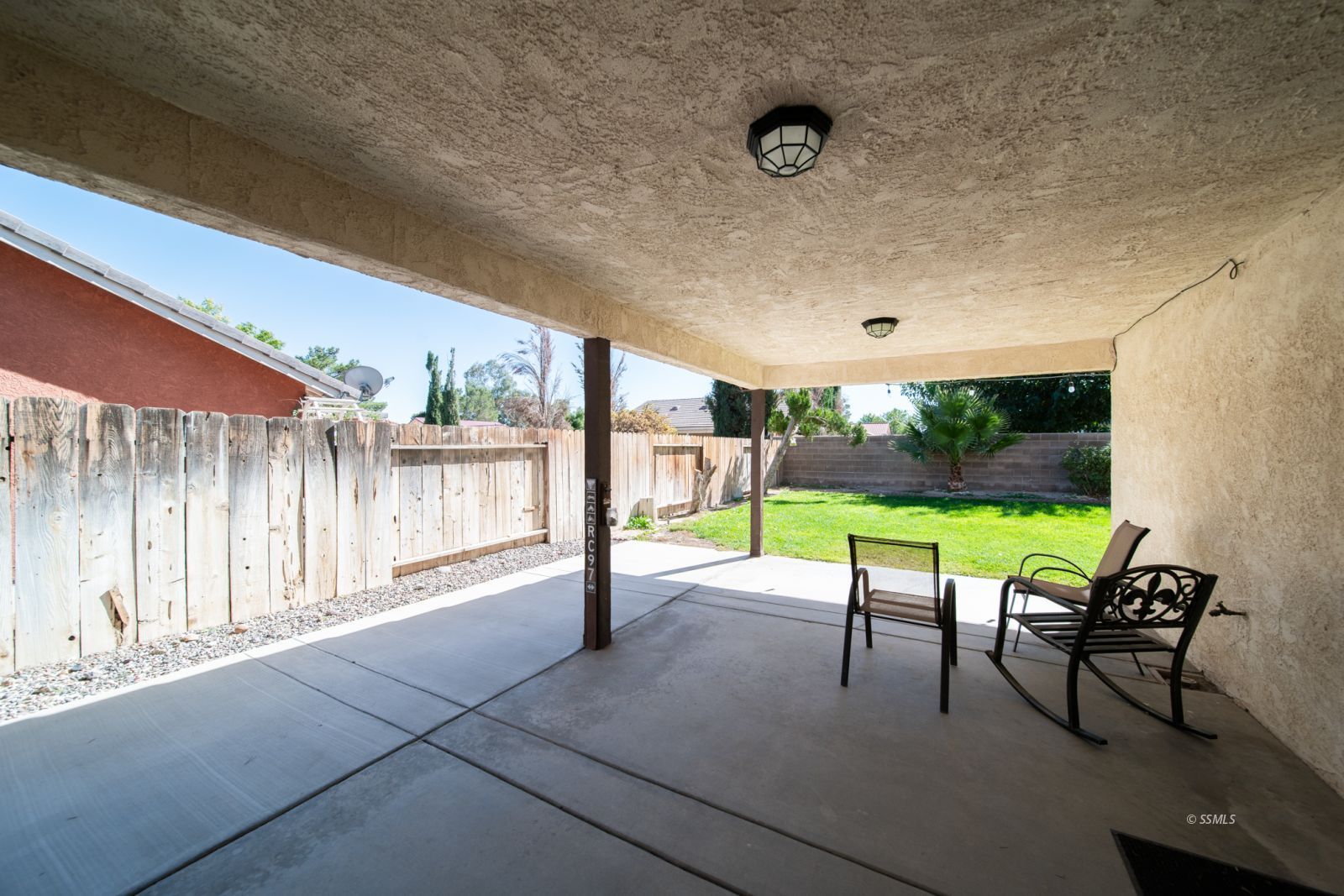 1205 Flora Way Ridgecrest, CA 93555 - Photo 41 of 46 a view of a patio with a backyard