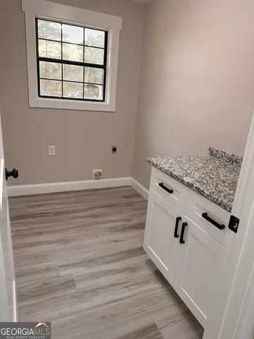 an empty room with wooden floor