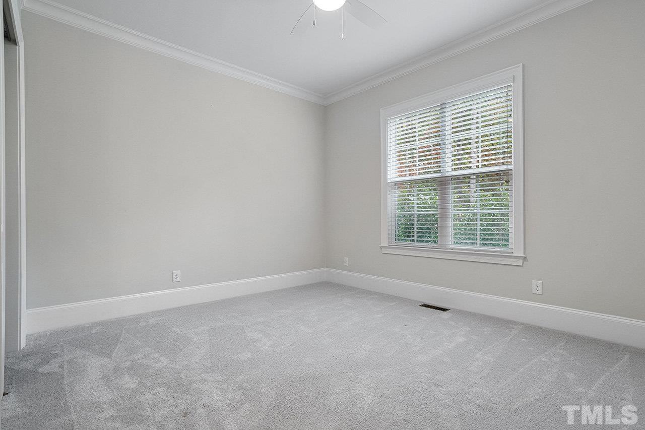 12309 Creedmoor Road Raleigh, NC 27613 - Photo 24 of 38 an empty room with a window