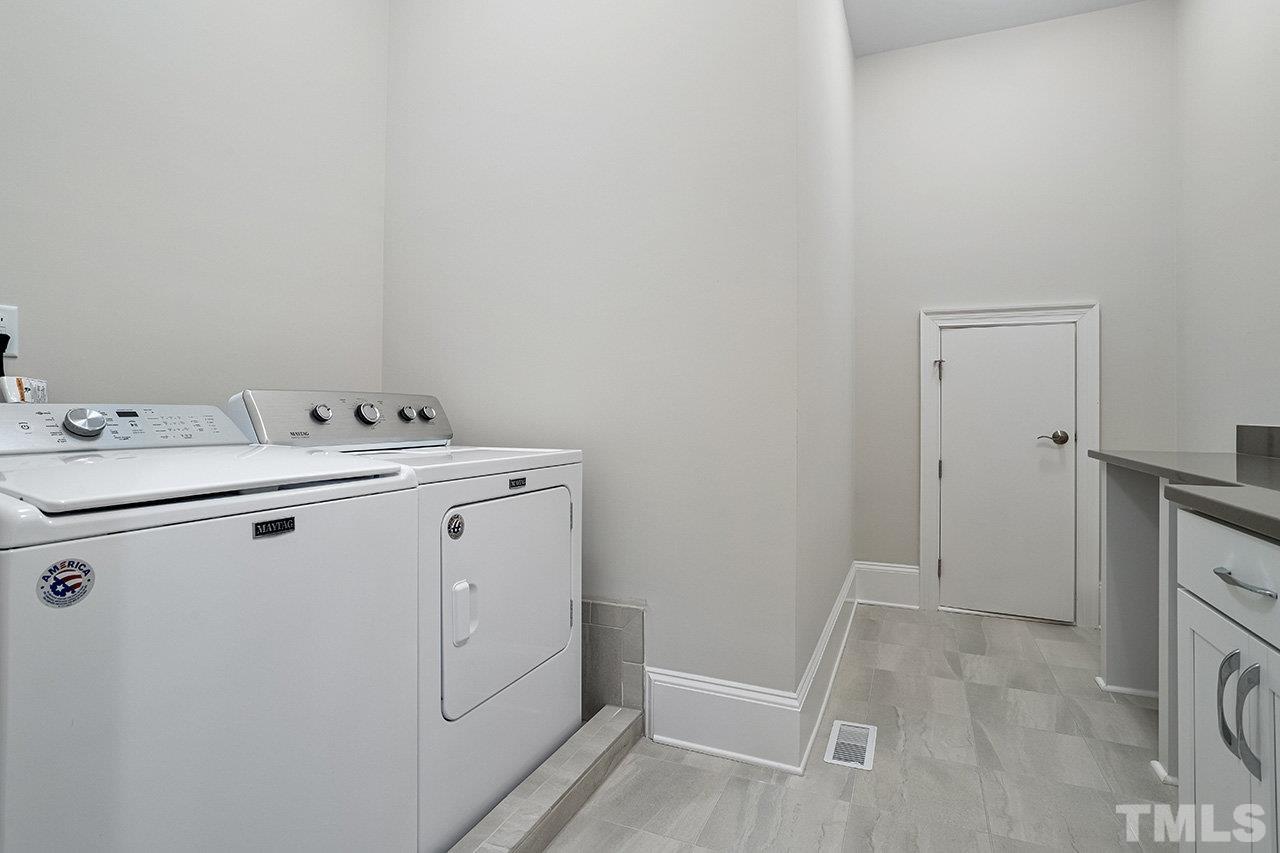 12309 Creedmoor Road Raleigh, NC 27613 - Photo 26 of 38 a utility room with dryer and washer