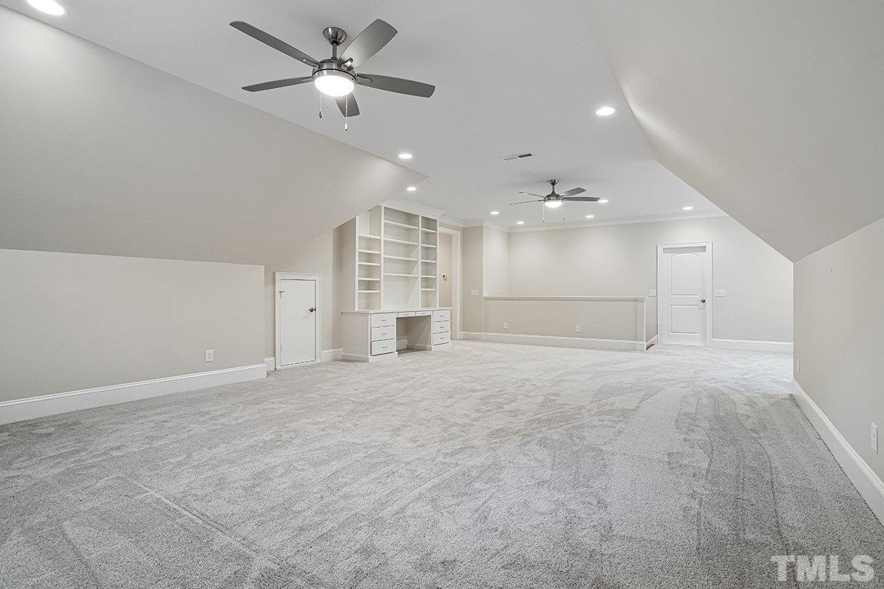 12309 Creedmoor Road Raleigh, NC 27613 - Photo 29 of 38 a view of an empty room and a ceiling fan