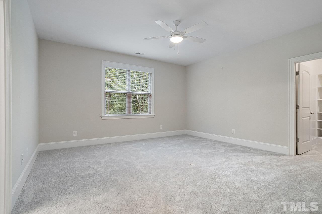 12309 Creedmoor Road Raleigh, NC 27613 - Photo 31 of 38 an empty room with a window