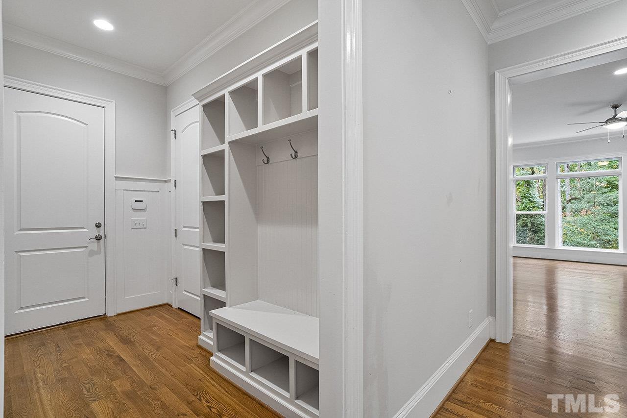 12309 Creedmoor Road Raleigh, NC 27613 - Photo 6 of 38 a view of an empty room with wooden floor and a window