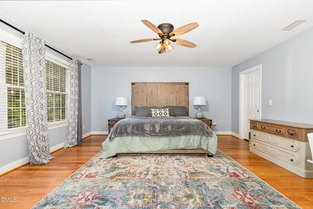 a bedroom with a large bed and a window