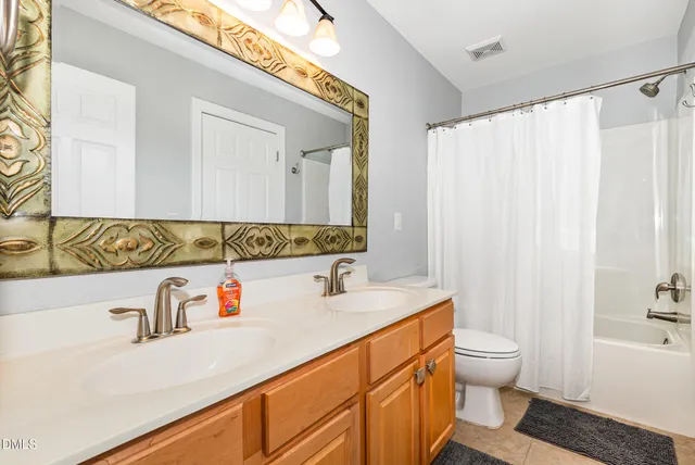 a bathroom with a sink a toilet and a bathtub