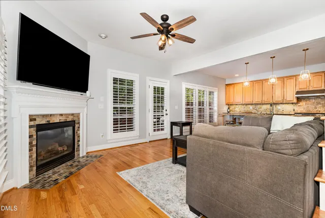a living room with furniture fireplace and flat screen tv