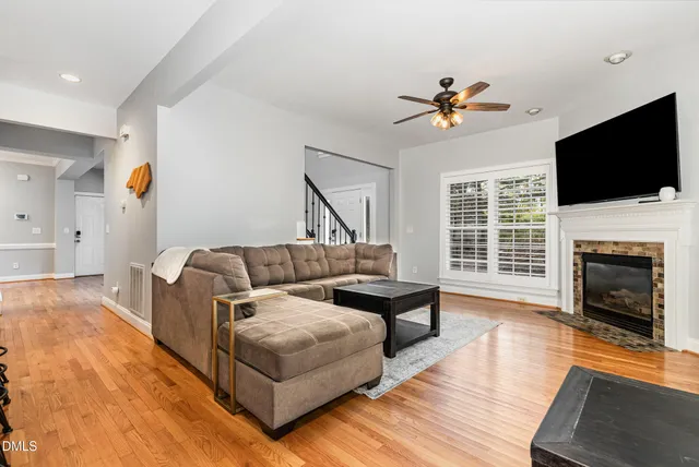 a living room with furniture fireplace and flat screen tv