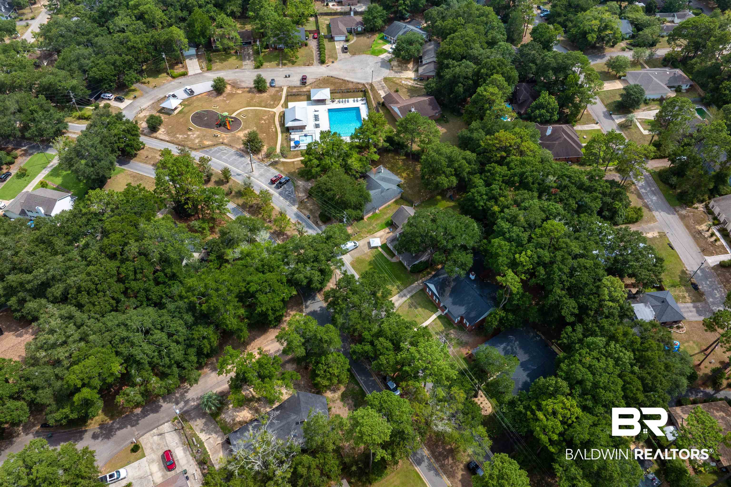 599 Ridgewood Drive Daphne, AL 36526 - Photo 40 of 41 Aerial view showcasing a community pool, playground, and surrounding residential properties