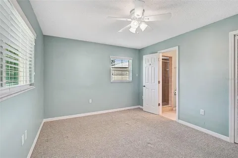 a view of an empty room with a bathroom