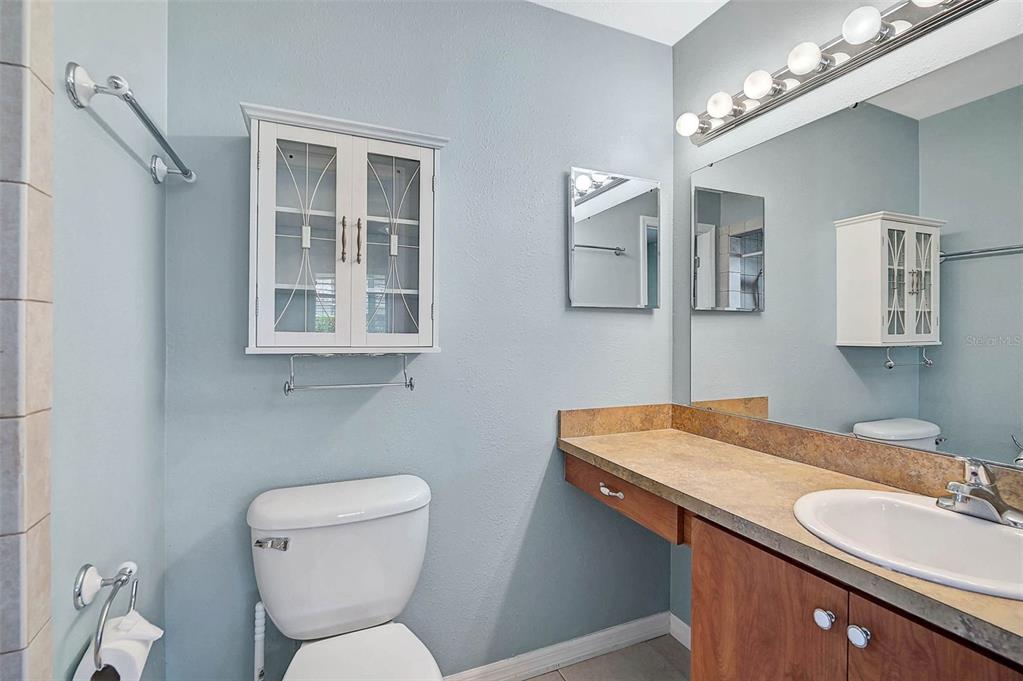 602 Park Circle Bradenton, FL 34207 - Photo 17 of 34 a bathroom with a toilet sink and mirror