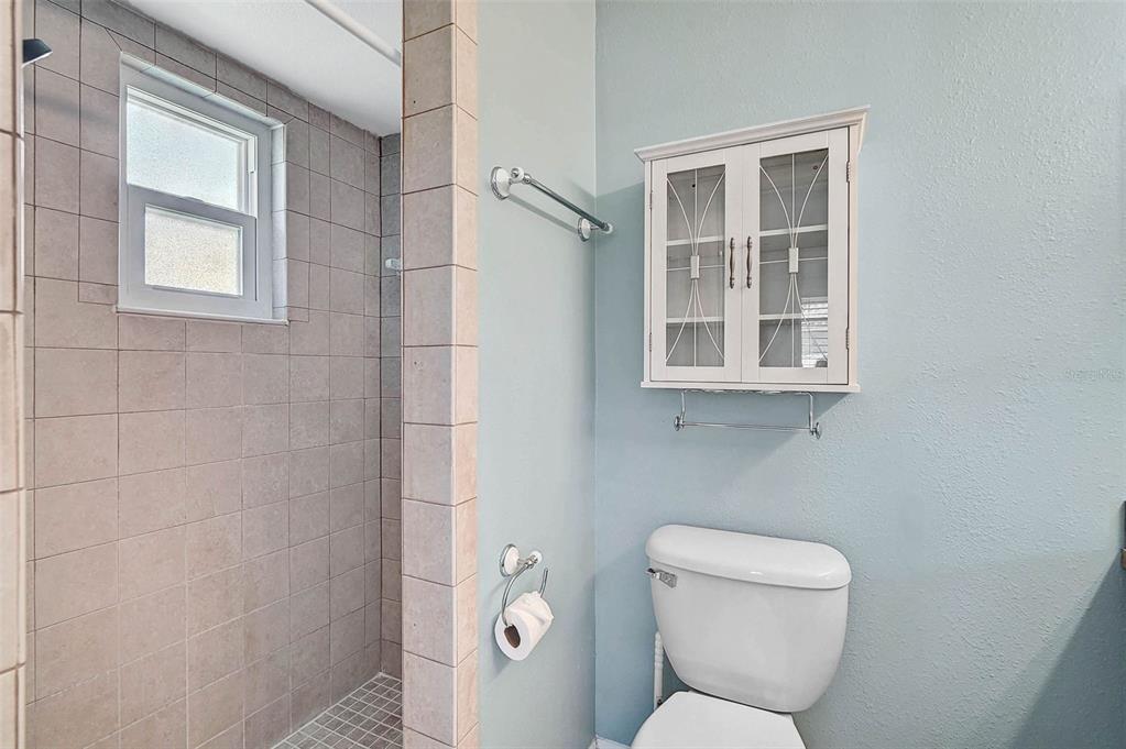 602 Park Circle Bradenton, FL 34207 - Photo 18 of 34 a white toilet sitting next to a bathroom sink