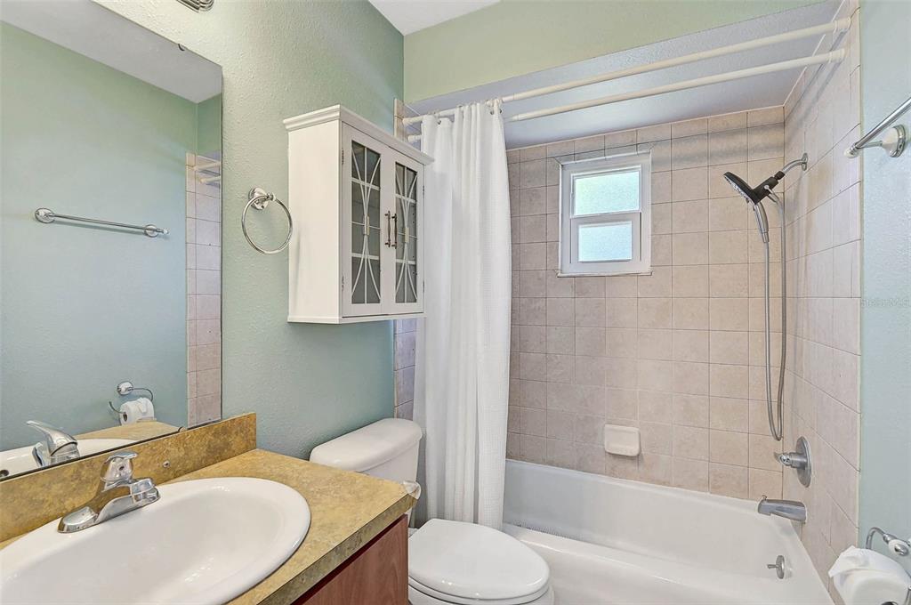 602 Park Circle Bradenton, FL 34207 - Photo 21 of 34 a bathroom with a sink toilet and shower