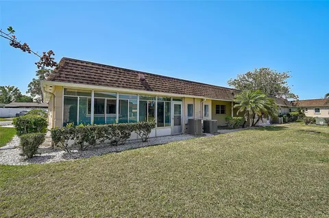 an aerial view of multiple houses with outdoor space