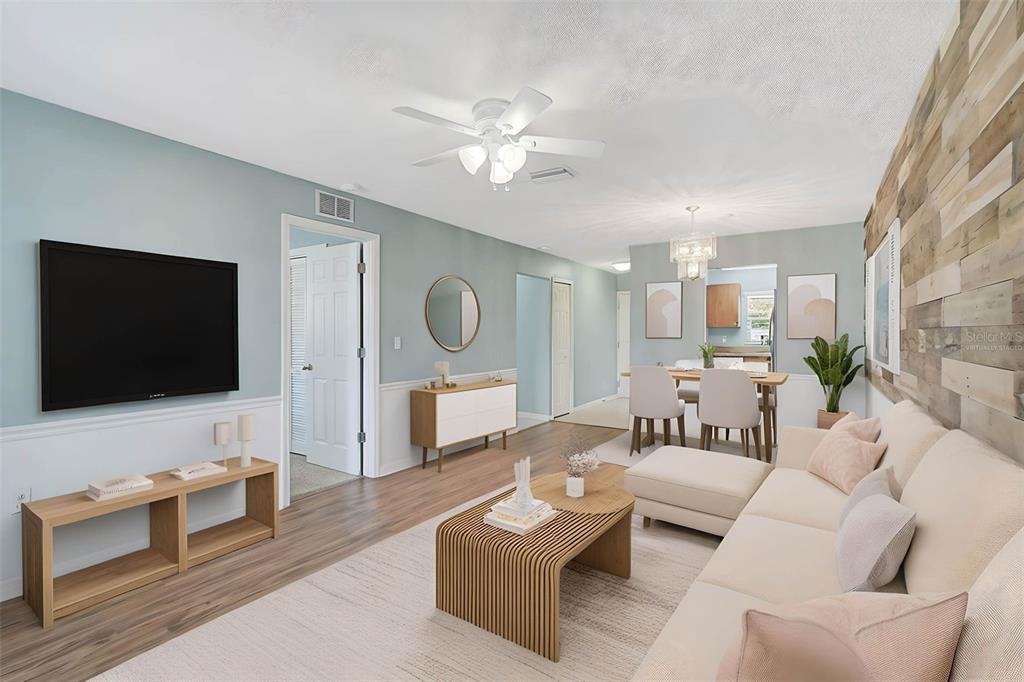 602 Park Circle Bradenton, FL 34207 - Photo 4 of 34 a living room with furniture and a flat screen tv