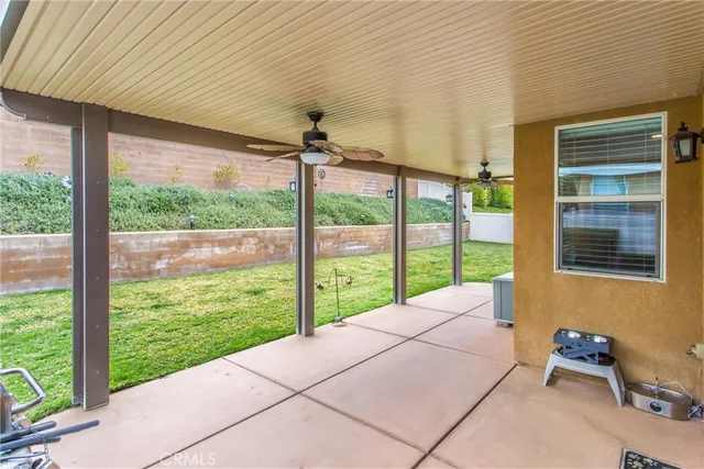 a view of a house with yard and sitting area