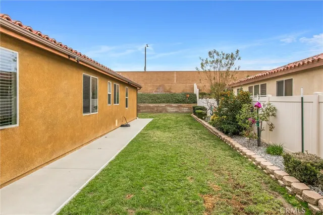 a view of a house with a yard porch and sitting area