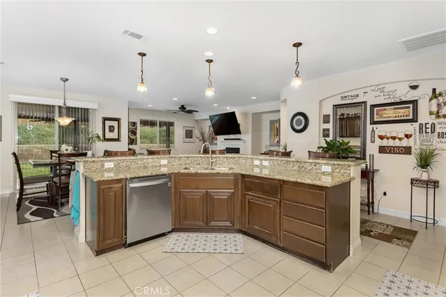 a kitchen with stainless steel appliances granite countertop a sink and cabinets