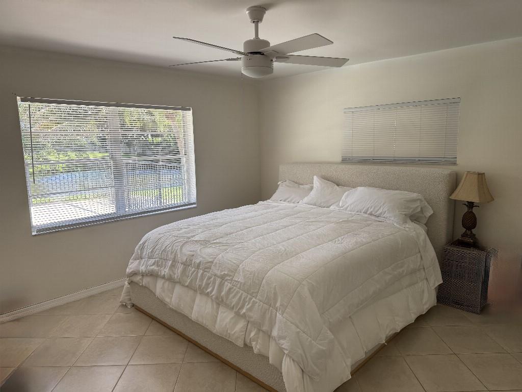 9774 Lancaster Place Boca Raton, FL 33434 - Photo 12 of 13 a bedroom with a bed and window