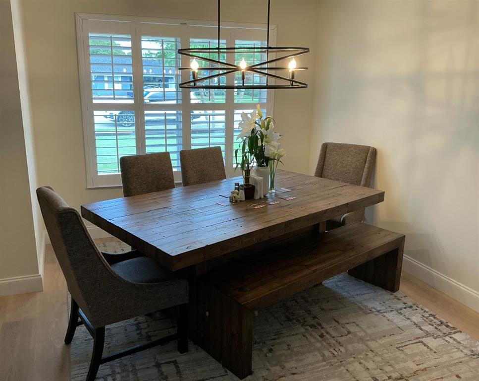 9774 Lancaster Place Boca Raton, FL 33434 - Photo 5 of 13 a view of a dining room with furniture and wooden floor
