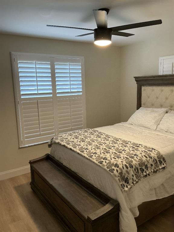 9774 Lancaster Place Boca Raton, FL 33434 - Photo 9 of 13 a bed sitting in a bedroom next to a window
