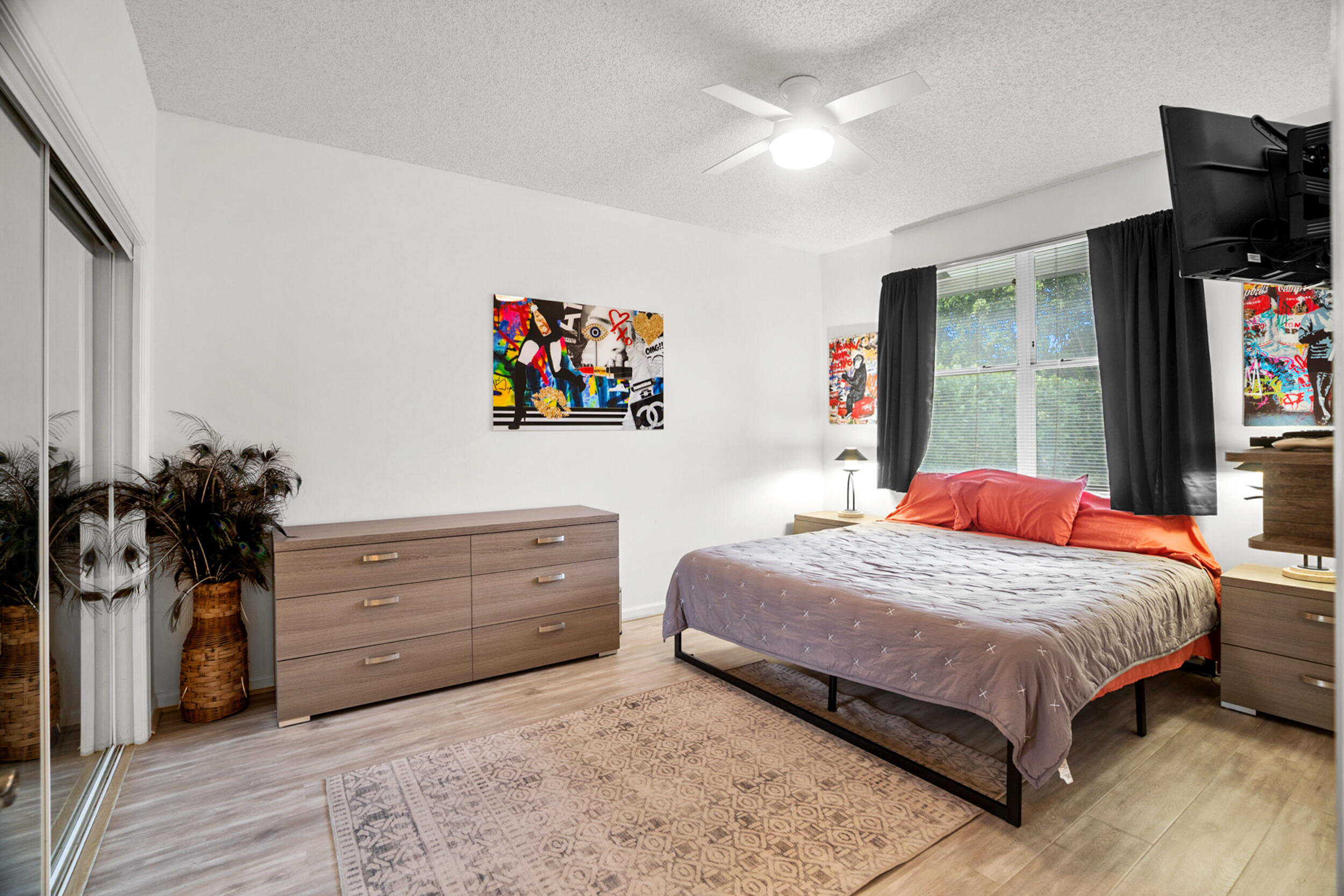 7946 Shelby Circle Boca Raton, FL 33496 - Photo 14 of 23 a bedroom with a bed and a flat screen tv