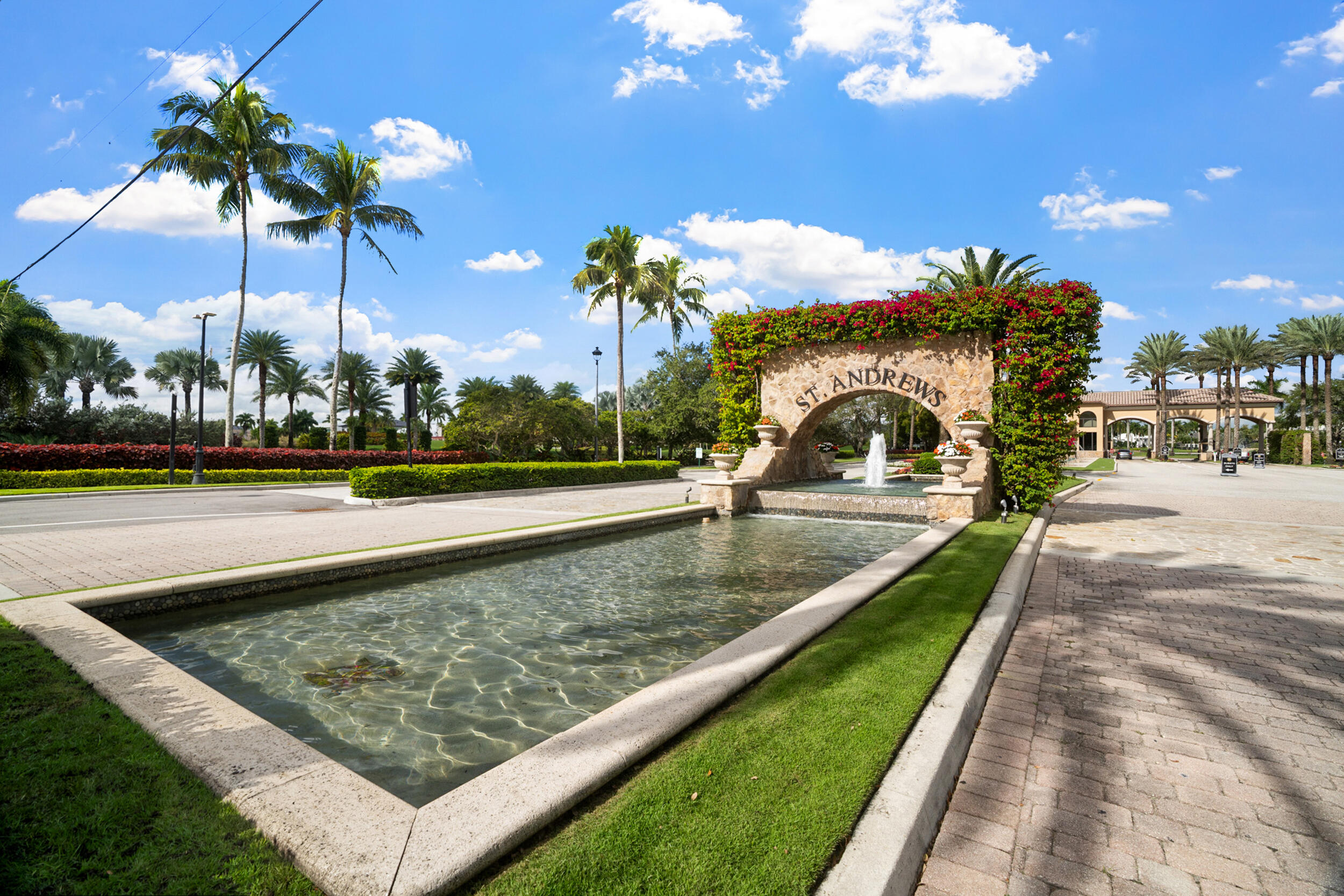 7946 Shelby Circle Boca Raton, FL 33496 - Photo 2 of 23 a view of a fountain in front of a house