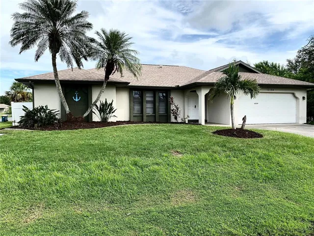 a view of a garden with palm trees