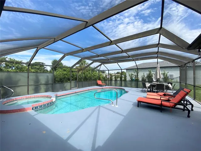 a sitting area with an umbrella