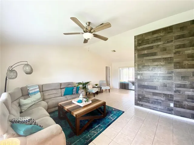 a living room with furniture and a rug