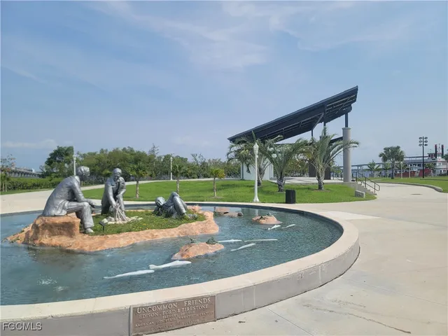 a view of a swimming pool with a yard