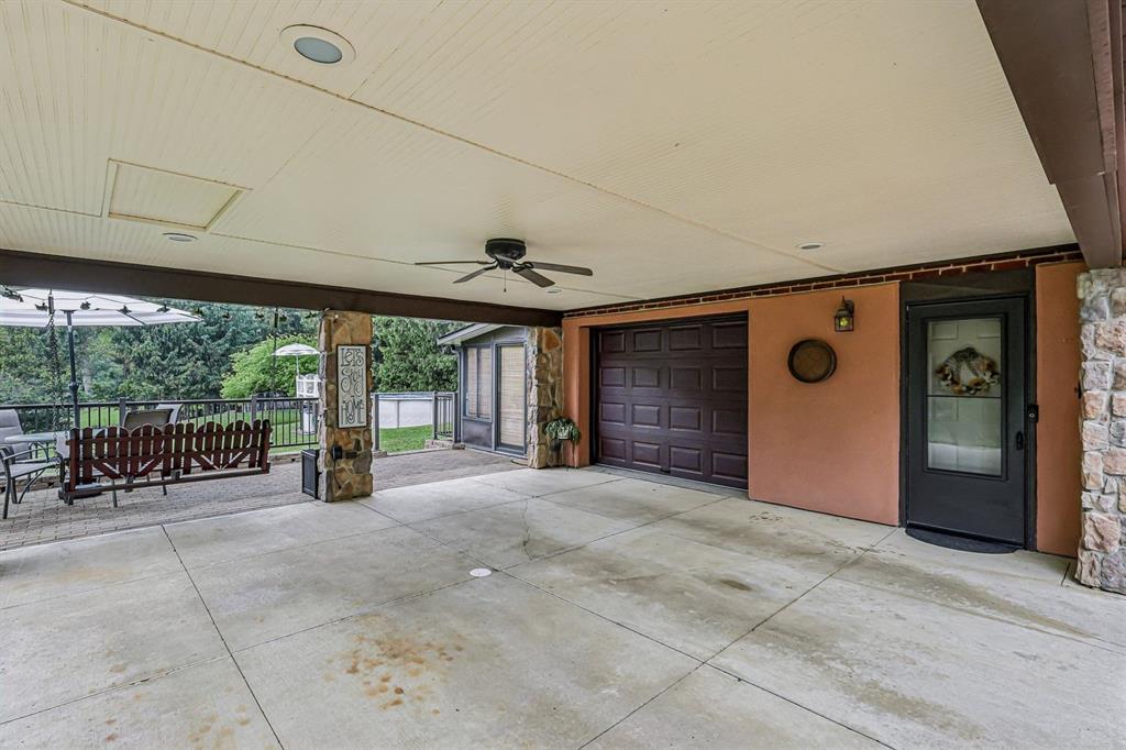 529 Utopia Road Apollo, PA 15613 - Photo 44 of 50 a view of a porch with furniture and floor to ceiling window