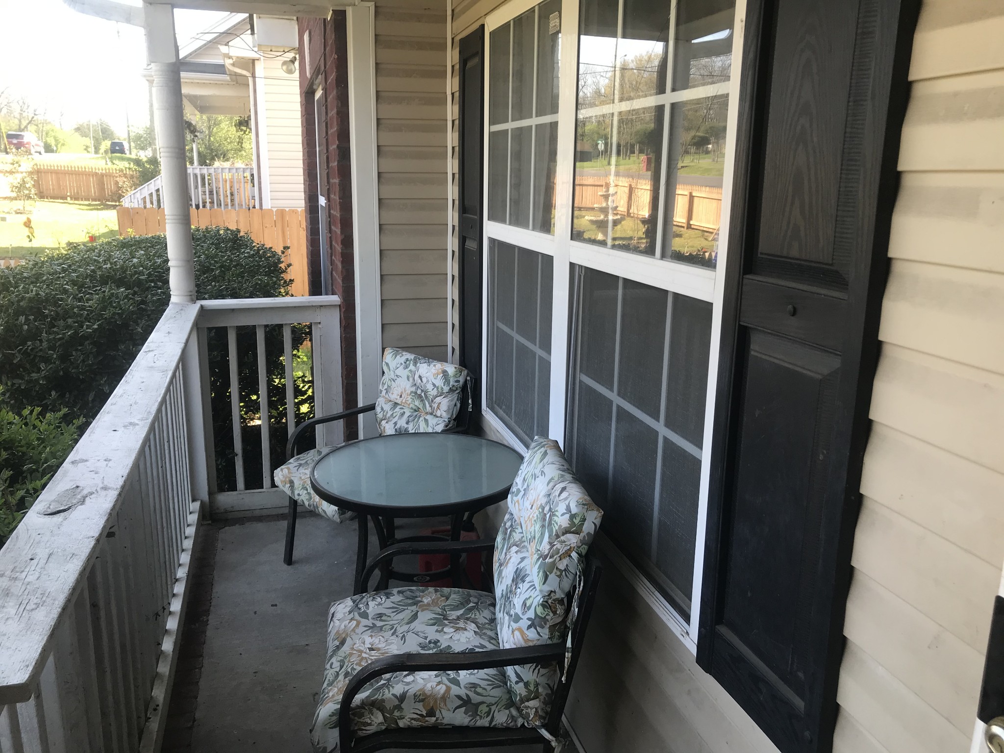 224 Larkin Springs Road Madison, TN 37115 - Photo 2 of 6 a balcony with a table and chairs