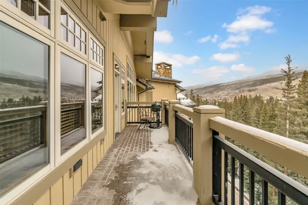 a view of a balcony with chairs