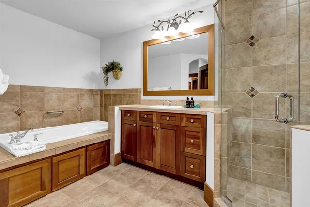 a bathroom with a sink vanity granite and a mirror
