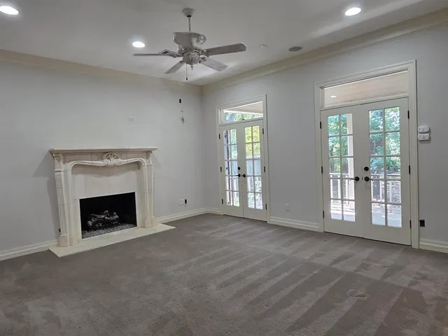 a large bathroom with a granite countertop tub a sink and a mirror