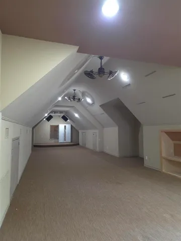 a view of a house with pool and chairs