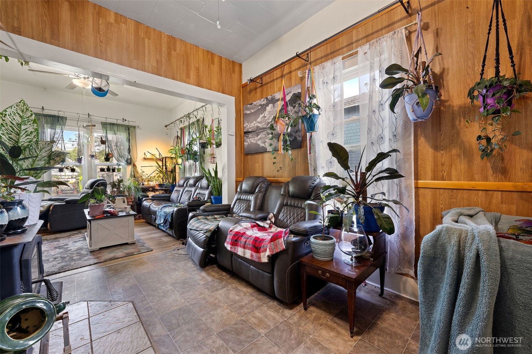 1218 Cedar Street Raymond, WA 98577 - Photo 12 of 31 a living room with furniture and a floor to ceiling window