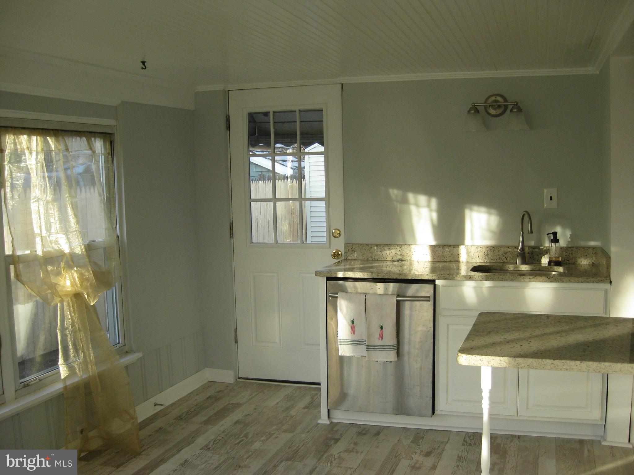 14 Lea Road New Castle, DE 19720 - Photo 7 of 21 Sunroom looking into kitchen