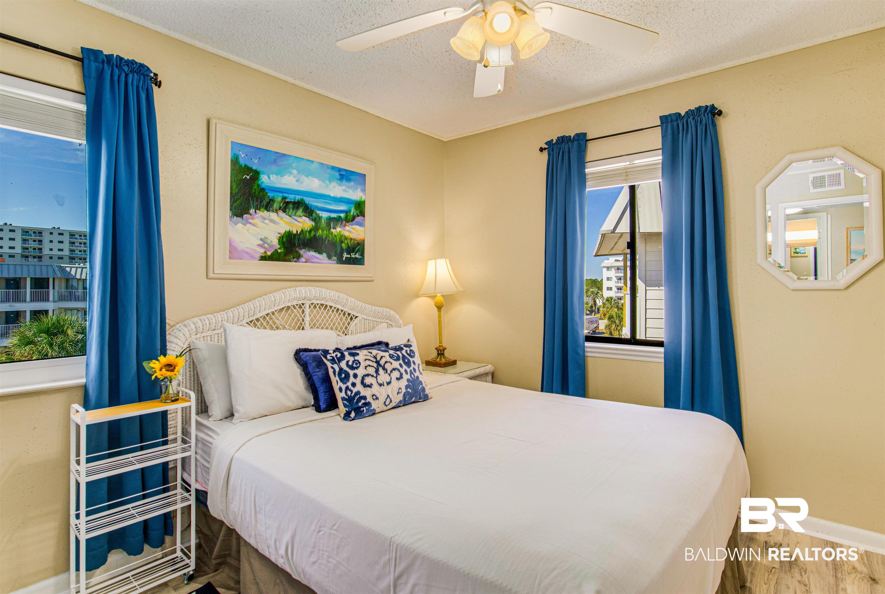 400 Plantation Road, Unit 1303 Gulf Shores, AL 36542 - Photo 7 of 24 Bedroom with ceiling fan, vinyl flooring, & fully furnished