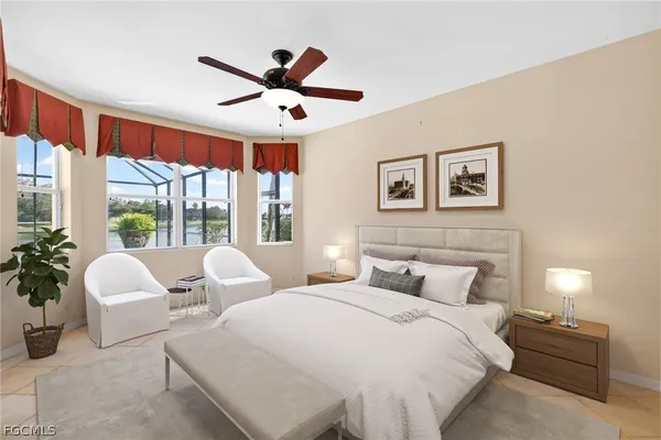 a bedroom with furniture and large windows