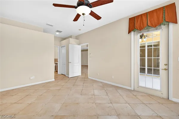 a view of an empty room with a window