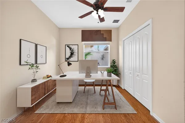a living room with furniture and wooden floor