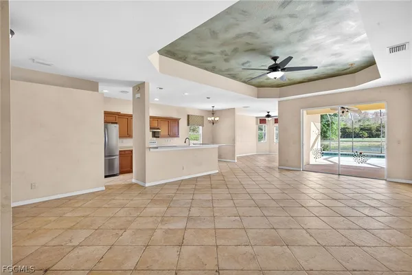 a view of empty room with wooden floor and fireplace