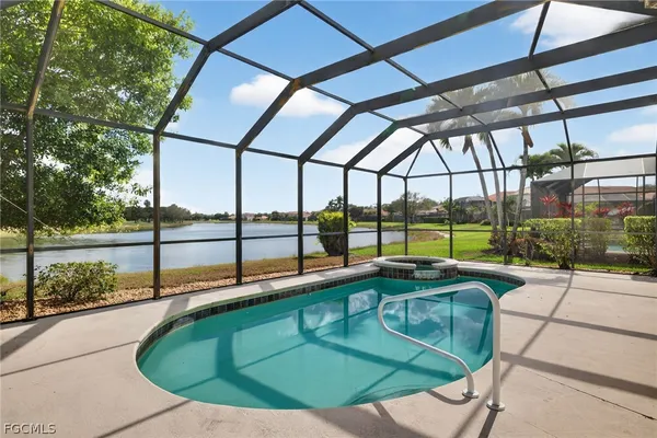 a view of a swimming pool with a yard
