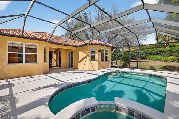 a view of a backyard with a swimming pool